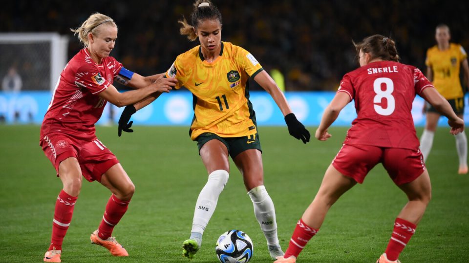 Denmark's defender #11 Katrine Veje (L) and Australia's forward #11 Mary Fowler (C) fight for the ball during the Australia and New Zealand 2023 Women's World Cup round of 16 football match between Australia and Denmark at Stadium Australia in Sydney on August 7, 2023. (Photo by FRANCK FIFE / AFP)