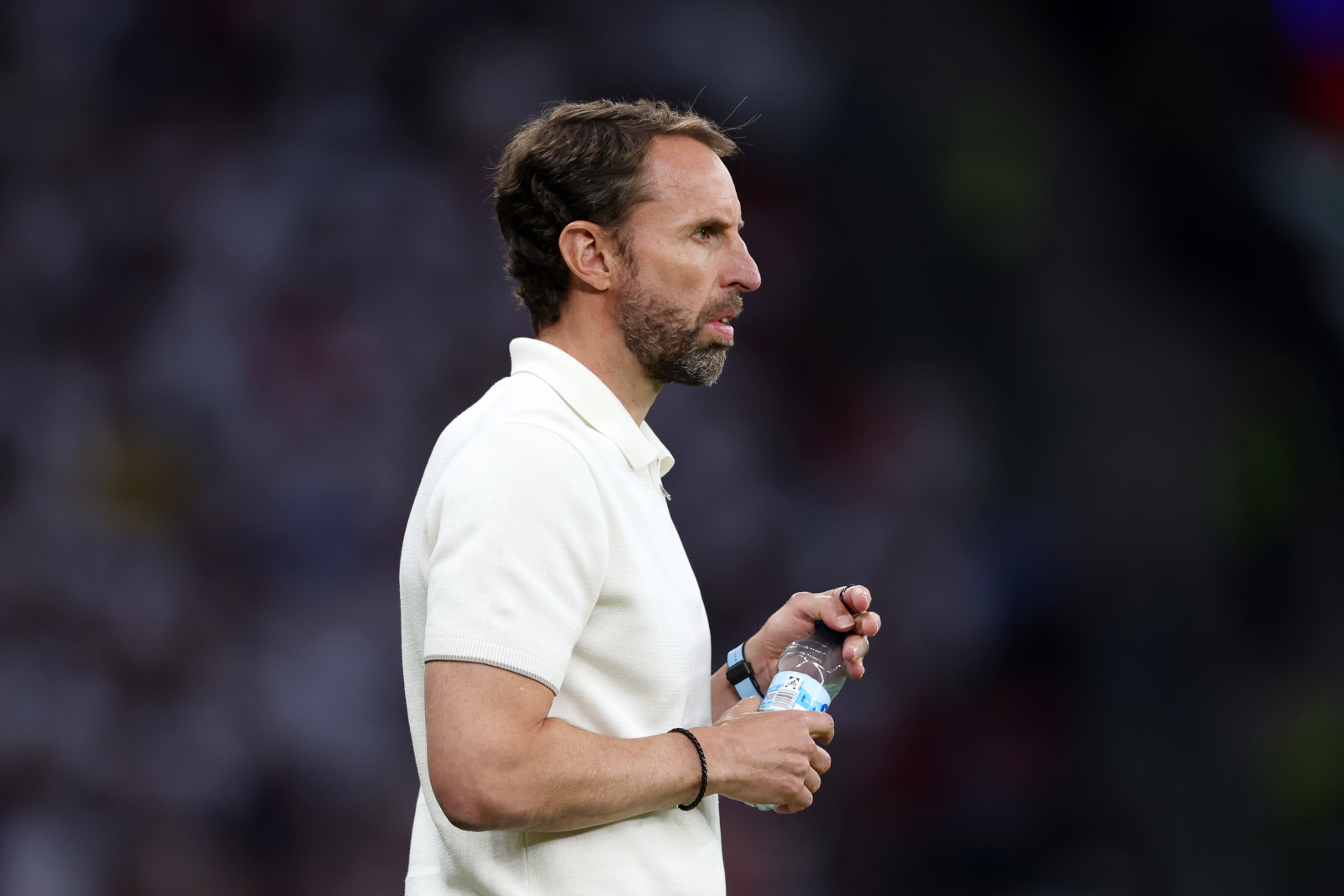 BERLIN, GERMANY - JULY 14: Gareth Southgate, Head Coach of England, takes a drink of water during the UEFA EURO 2024 final match between Spain and England at Olympiastadion on July 14, 2024 in Berlin, Germany. (Photo by Alex Pantling - UEFA/UEFA via Getty Images)