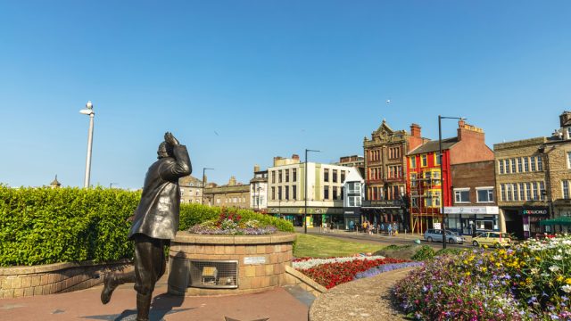 Morecambe, UK - July 20, 2021: Bronze statue of famous English comedian Eric Morecambe at the seafront of Lancashire town of Morecambe. — Photo by Debu55y