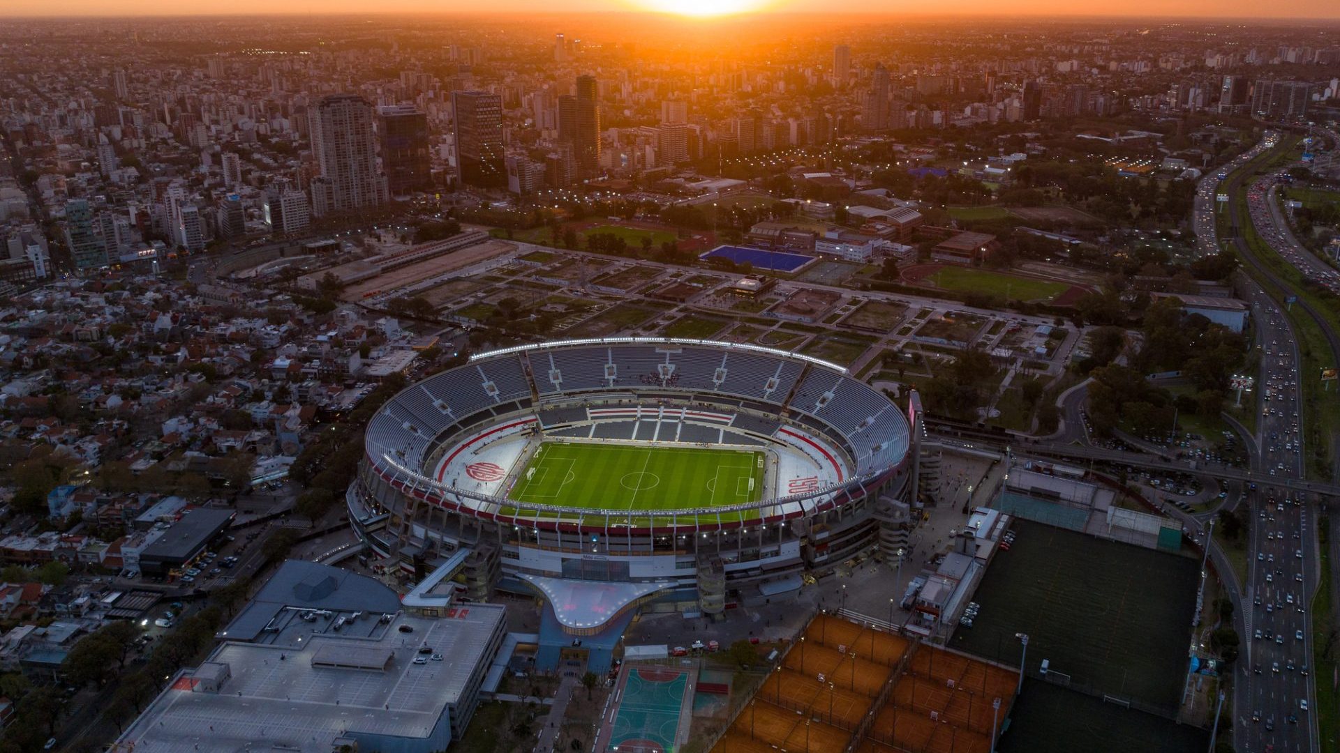 Buenos Aires, Argentina, September 13, 2024: Aerial view of the River Plate football team stadium at sunset. The city of Buenos Aires in the background. — Photo by sobrevolandopatagonia@gmail.com