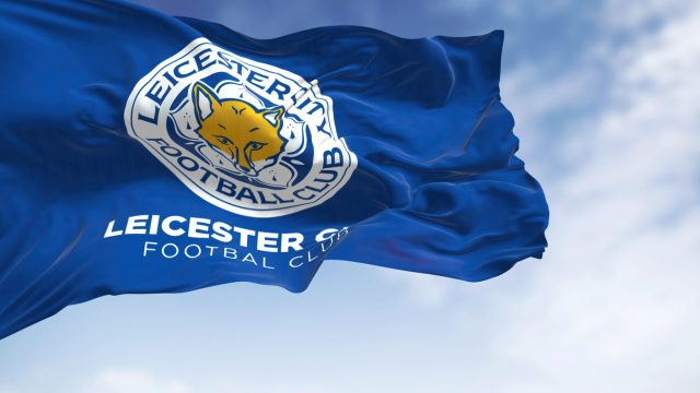 Leicester, UK, Oct. 2022: The flag of Leicester City Football Club waving in the wind. Leicester City FC is an English football club based in the city of Leicester. 3D illustration render — Photo by rarrarorro