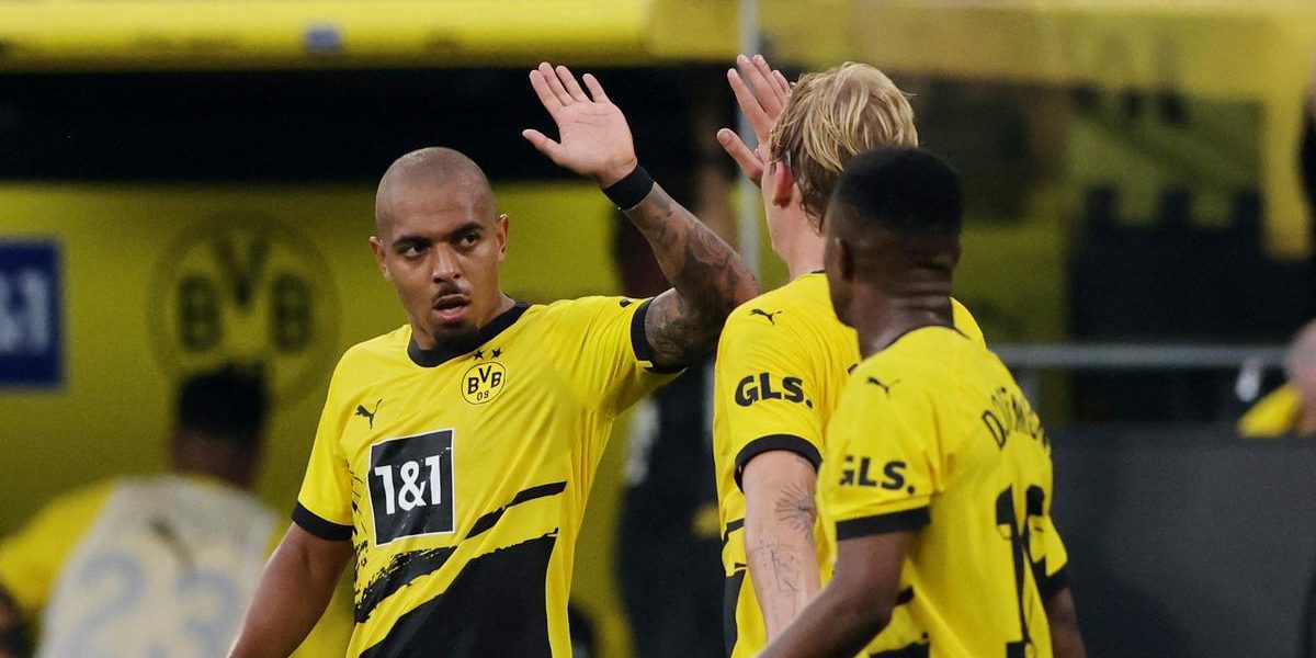 Malen scores after cancelled substitution for Dortmund to start Bundesliga with win over Cologne