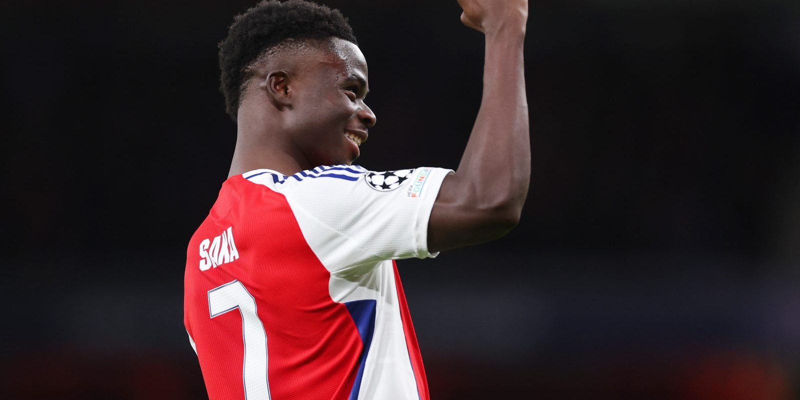 LONDON, ENGLAND - DECEMBER 11: Bukayo Saka of Arsenal celebrates scoring his team's second goal during the UEFA Champions League 2024/25 League Phase MD6 match between Arsenal FC and AS Monaco at Emirates Stadium on December 11, 2024 in London, England. (Photo by Julian Finney - UEFA/UEFA via Getty Images)