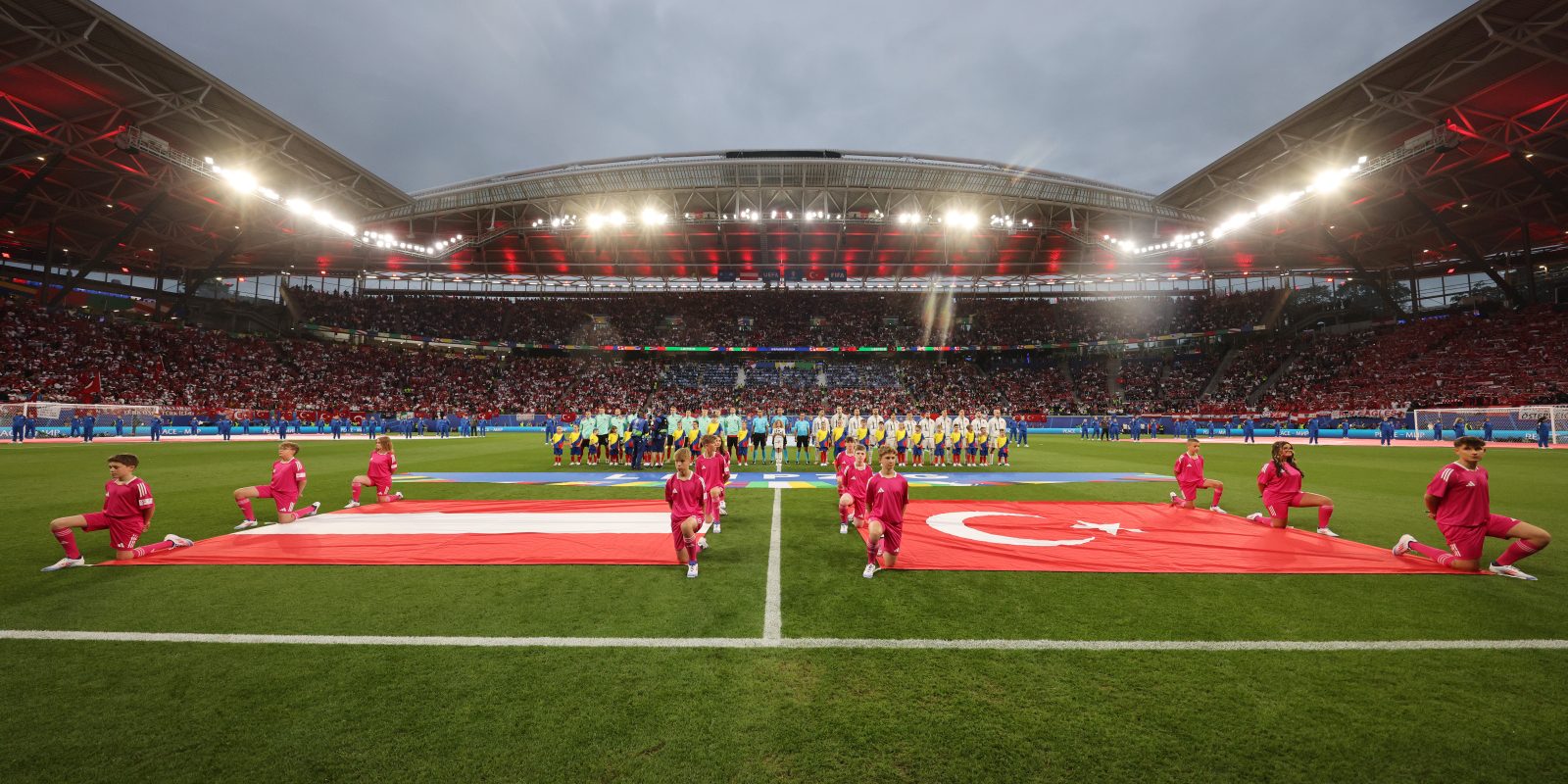 LEIPZIG, GERMANY - JULY 02: A general view of the inside of the stadium as players of Austria and Turkiye line up during the National Anthems prior to the UEFA EURO 2024 round of 16 match between Austria and Turkiye at Football Stadium Leipzig on July 02, 2024 in Leipzig, Germany. (Photo by Boris Streubel - UEFA/UEFA via Getty Images)