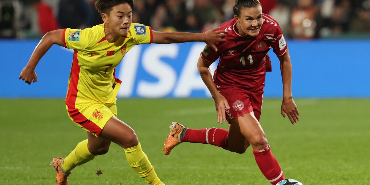 China's forward #07 Wang Shuang (L) and Denmark's defender #11 Katrine Veje vie for the ball during the Australia and New Zealand 2023 Women's World Cup Group D football match between Denmark and China at Perth Rectangular Stadium in Perth on July 22, 2023. (Photo by Colin MURTY / AFP)