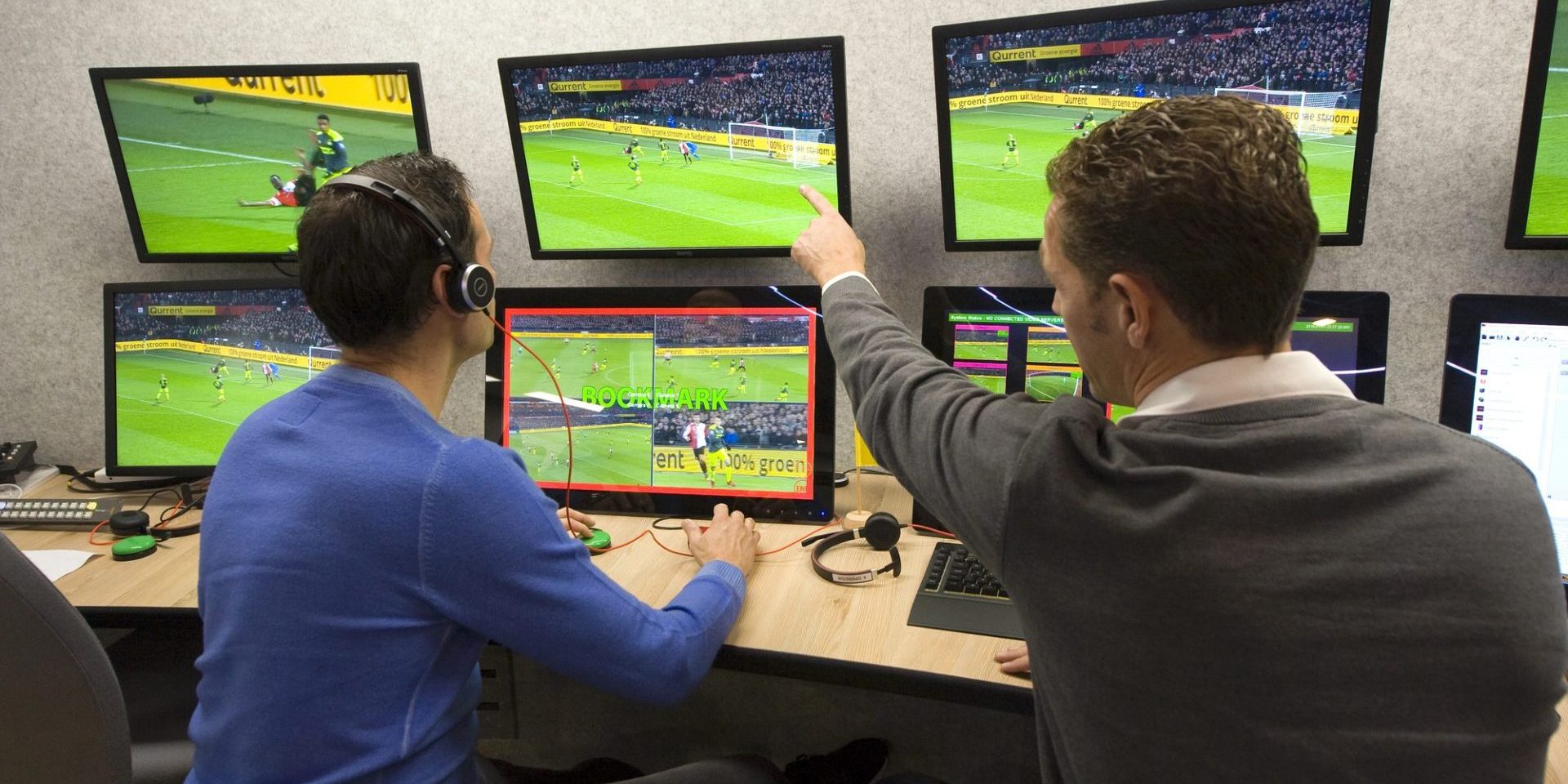 ZEIST, THE NETHERLANDS - NOV 30, 2018: VAR referee Bas Nijhuis (left) and his operator Mike van der Roest (right) working at the VAR center in the headquarters of the Dutch football federation. — Photo by Buurserstraat38
