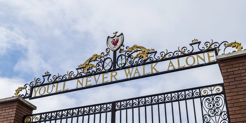 Looking up at the Shankly Gates outside the home of Liverpool Football Club. — Photo by wellsie82