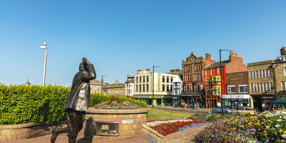 Morecambe, UK - July 20, 2021: Bronze statue of famous English comedian Eric Morecambe at the seafront of Lancashire town of Morecambe. — Photo by Debu55y