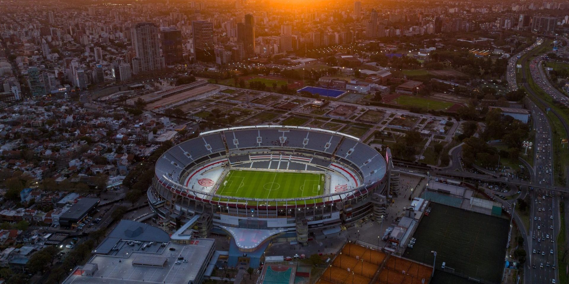 Buenos Aires, Argentina, September 13, 2024: Aerial view of the River Plate football team stadium at sunset. The city of Buenos Aires in the background. — Photo by sobrevolandopatagonia@gmail.com