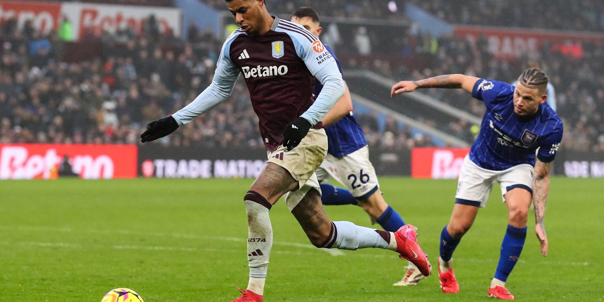 Marcus Rashford of Aston Villa goes forward with the ball during the Premier League match Aston Villa vs Ipswich Town at Villa Park, Birmingham, United Kingdom, 15th February 2025 — Photo by operations@newsimages.co.uk
