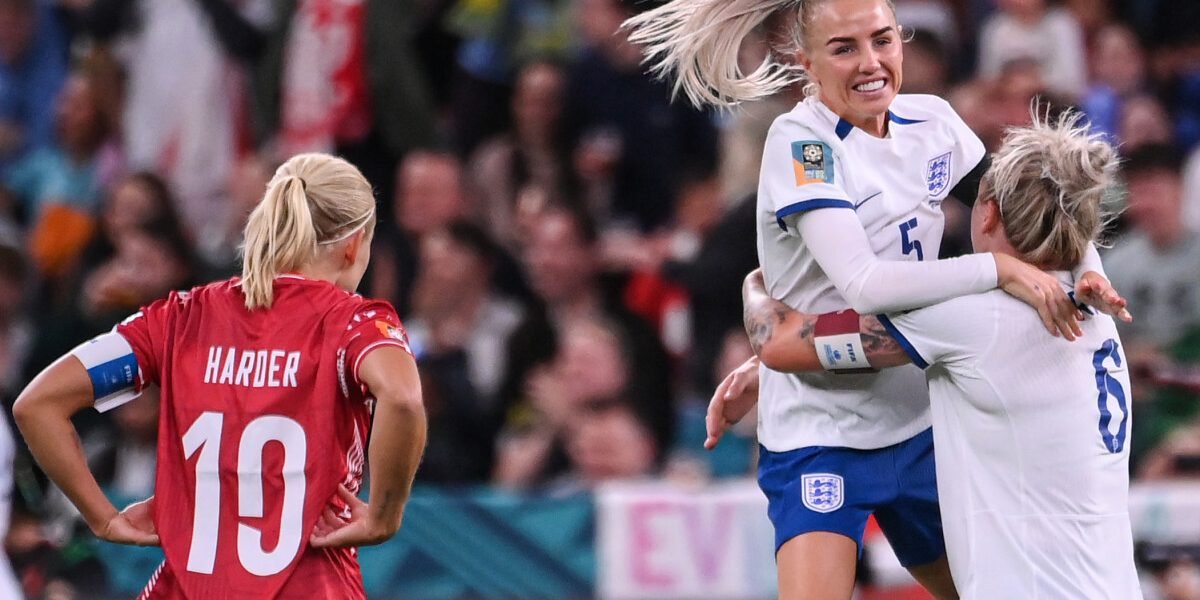 England's defender #05 Alex Greenwood (2R) celebrates with England's defender #06 Millie Bright (R) after a goal scored by England's forward #07 Lauren James (unseen) as Denmark's forward #10 Pernille Harder (L) reacts during the Australia and New Zealand 2023 Women's World Cup Group D football match between England and Denmark at Sydney Football Stadium in Sydney on July 28, 2023. (Photo by FRANCK FIFE / AFP)