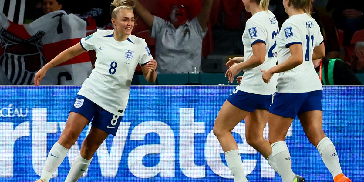 England's midfielder #08 Georgia Stanway (L) celebrates with her teammates after scoring her team's first goal during the Australia and New Zealand 2023 Women's World Cup Group D football match between England and Haiti at Brisbane Stadium in Brisbane on July 22, 2023. (Photo by Patrick Hamilton / AFP)