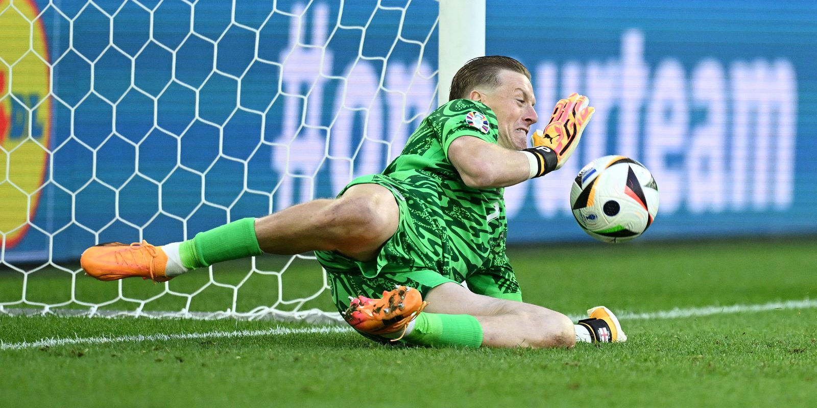 DUSSELDORF, GERMANY - JULY 06: Jordan Pickford of England saves the first penalty from Manuel Akanji of Switzerland (not pictured) in the penalty shoot out during the UEFA EURO 2024 quarter-final match between England and Switzerland at D?sseldorf Arena on July 06, 2024 in Dusseldorf, Germany. (Photo by Michael Regan - UEFA/UEFA via Getty Images)