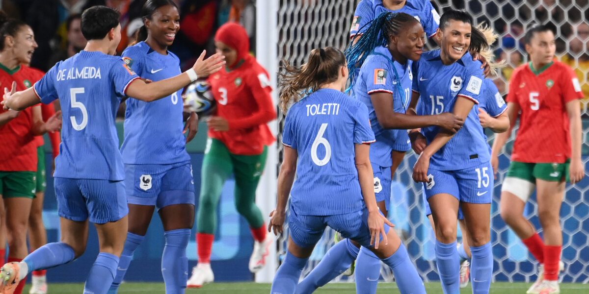 France's midfielder #15 Kenza Dali (R) celebrates with teammates scoring her team's second goal during the Australia and New Zealand 2023 Women's World Cup round of 16 football match between France and Morocco at Hindmarsh Stadium in Adelaide on August 8, 2023. (Photo by FRANCK FIFE / AFP)