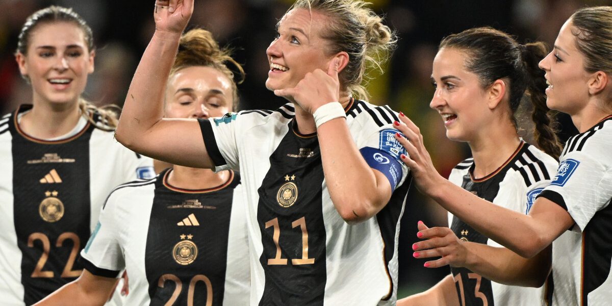 Germany's forward #11 Alexandra Popp (C) celebrates with teammates after scoring her team's second goal during the Australia and New Zealand 2023 Women's World Cup Group H football match between Germany and Morocco at Melbourne Rectangular Stadium, also known as AAMI Park, in Melbourne on July 24, 2023. (Photo by WILLIAM WEST / AFP)