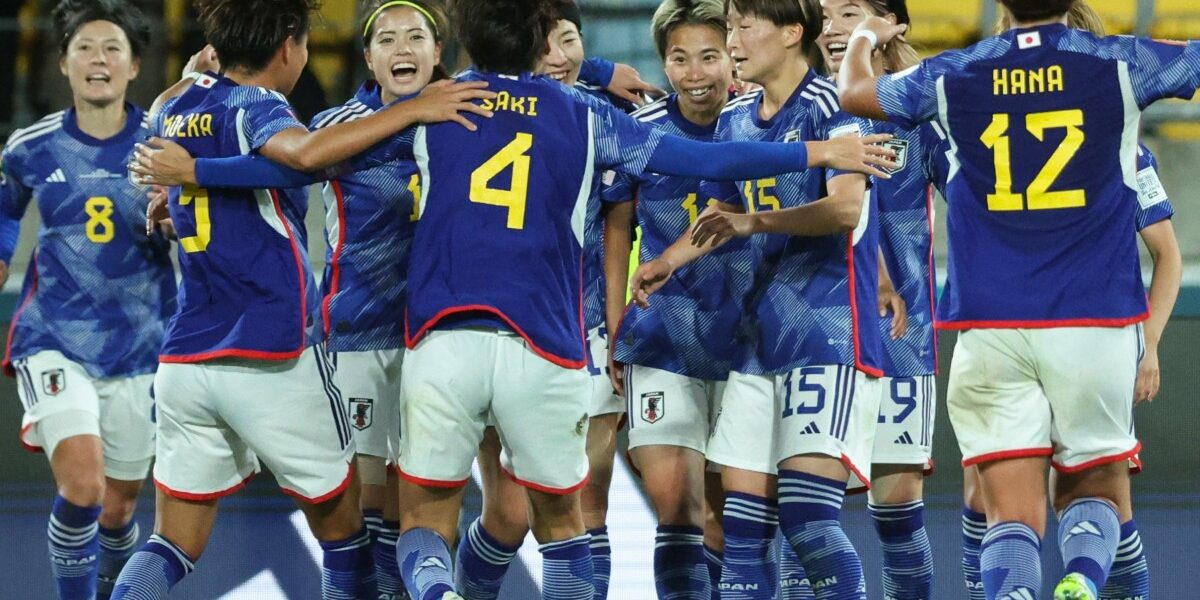 Japan's forward #11 Mina Tanaka (C) celebrates with her teammates after scoring her team's fourth goal during the Australia and New Zealand 2023 Women's World Cup Group C football match between Japan and Spain at Wellington Stadium, also known as Sky Stadium, in Wellington on July 31, 2023. (Photo by Marty MELVILLE / AFP)