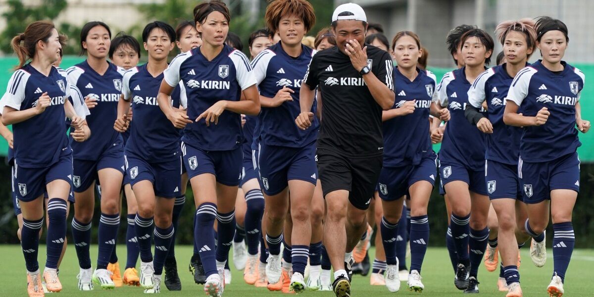 Players of Japan women's national football team run on a soccer field at the end of their training session in Makuhari, Chiba prefecture on July 6, 2023. (Photo by Kazuhiro NOGI / AFP)