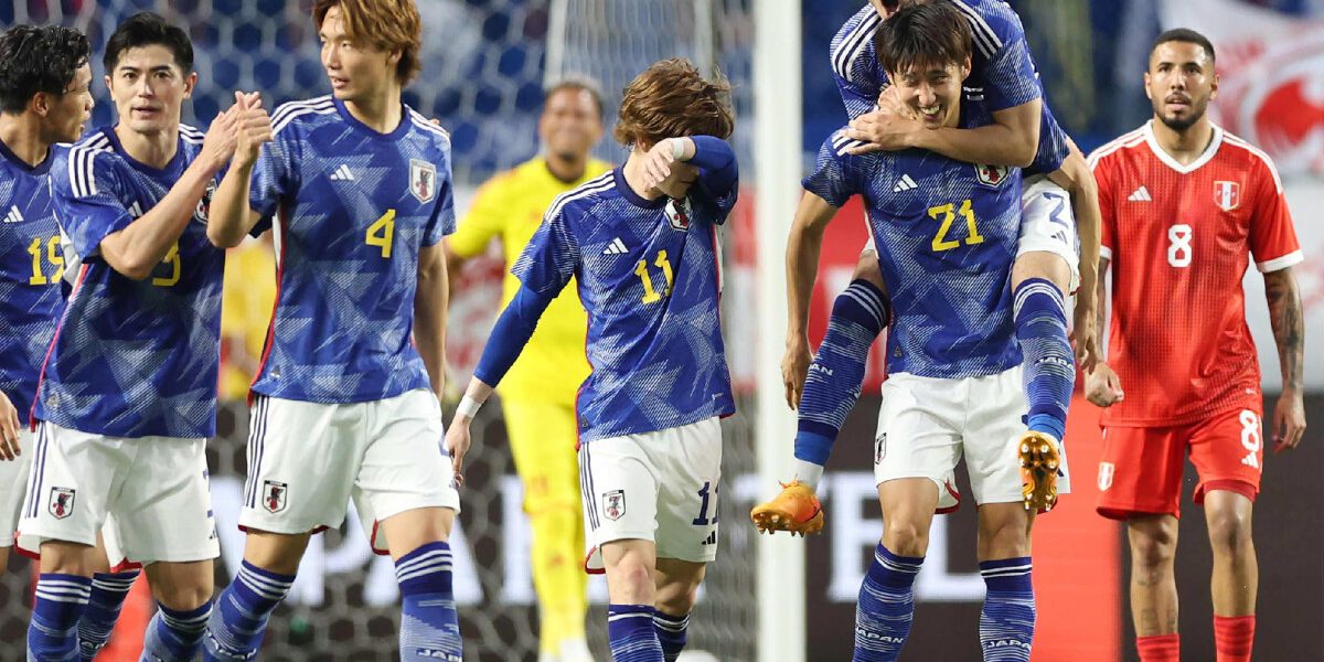 Japan's Hiroki Ito (2nd R-#21) celebrates with teammates after scoring the team's first goal during the friendly football match between Japan and Peru at Suita City Stadium in the city of Suita, Osaka prefecture on June 20, 2023. (Photo by STR / JIJI Press / AFP) / Japan OUT / JAPAN OUT