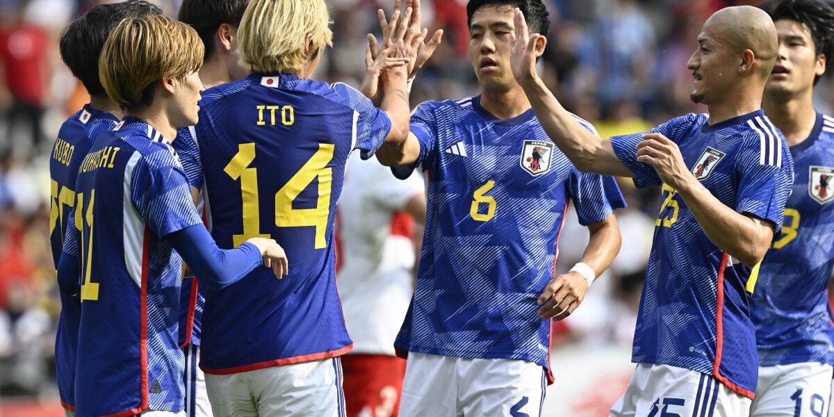 Japan's midfielder #14 Junya Ito (3rd L) celebrates with teammates after scoring a penalty kick during the friendly football match between Japan and Turkey at the Cegeka Arena in Genk, eastern Belgium, on September 12, 2023. (Photo by JOHN THYS / AFP)