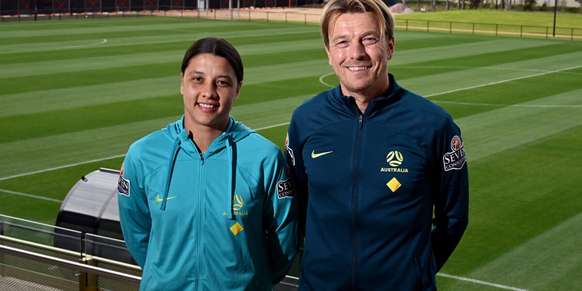 Australia's soccer captain Sam Kerr (L) poses for photos with coach Tony Gustavsson (R)  in Melbourne on July 3, 2023 after Australia named their squad for the upcoming FIFA Women's World Cup 2023 football tournament to be held in Australia and New Zealand. (Photo by William WEST / AFP) / --IMAGE RESTRICTED TO EDITORIAL USE - STRICTLY NO COMMERCIAL USE-- - --IMAGE RESTRICTED TO EDITORIAL USE - STRICTLY NO COMMERCIAL USE--