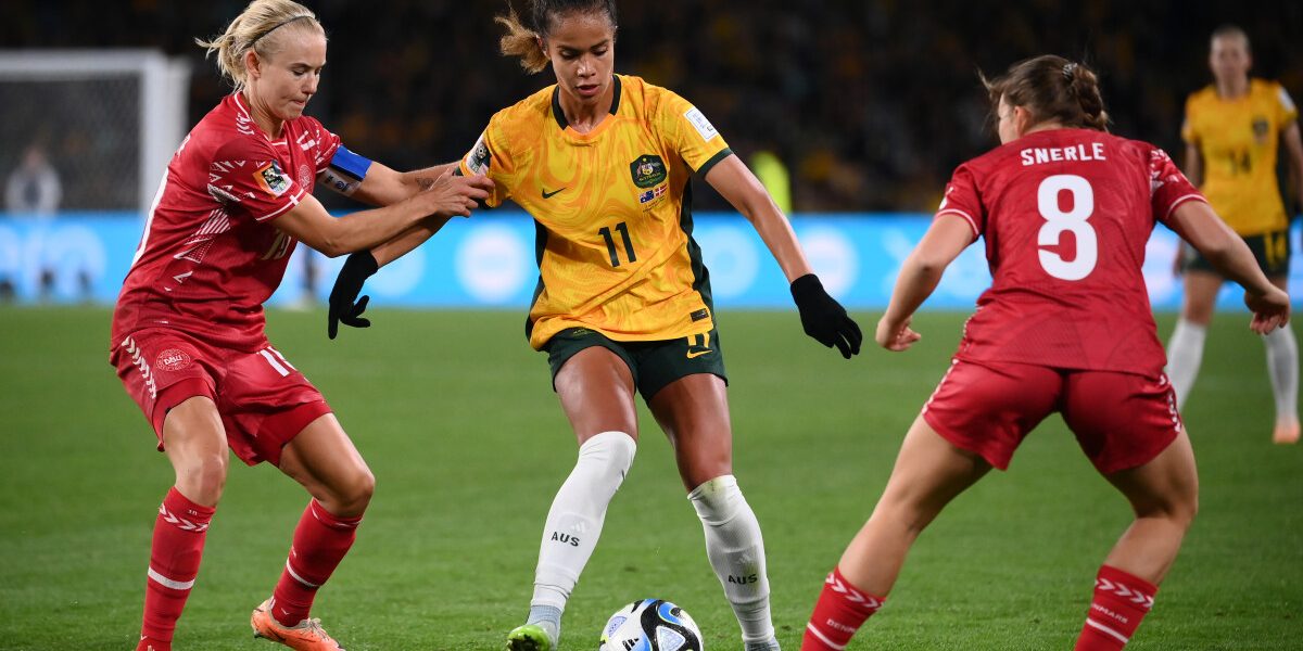 Denmark's defender #11 Katrine Veje (L) and Australia's forward #11 Mary Fowler (C) fight for the ball during the Australia and New Zealand 2023 Women's World Cup round of 16 football match between Australia and Denmark at Stadium Australia in Sydney on August 7, 2023. (Photo by FRANCK FIFE / AFP)