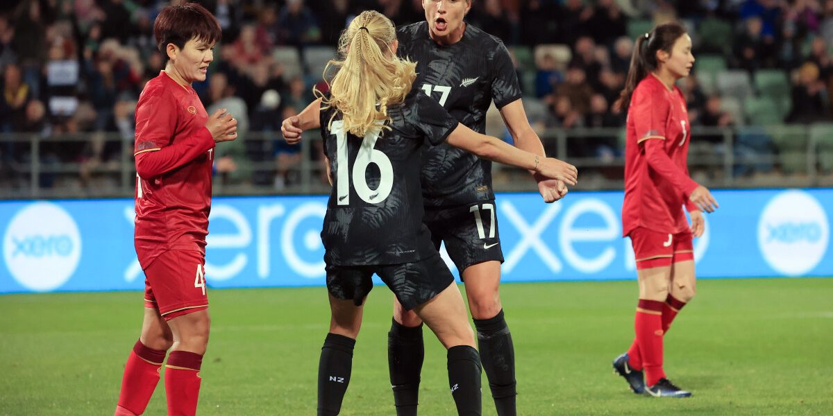 New Zealand's Hannah Wilkinson (2nd R) congratulates teammate Jacqui Hand on her goal during the women's international friendly football match between New Zealand and Vietnam ahead of the Women's World Cup 2023 football tournament, in Napier on July 10, 2023. (Photo by Dave LINTOTT / AFP)