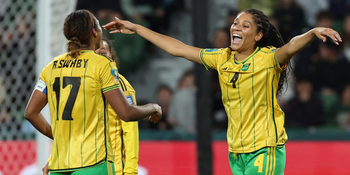 Jamaica's defender #17 Allyson Swaby (L) celebrates scoring her team's first goal with teammate Jamaica's defender #04 Chantelle Swaby during the Australia and New Zealand 2023 Women's World Cup Group F football match between Panama and Jamaica at Perth Rectangular Stadium in Perth on July 29, 2023. (Photo by Colin MURTY / AFP)