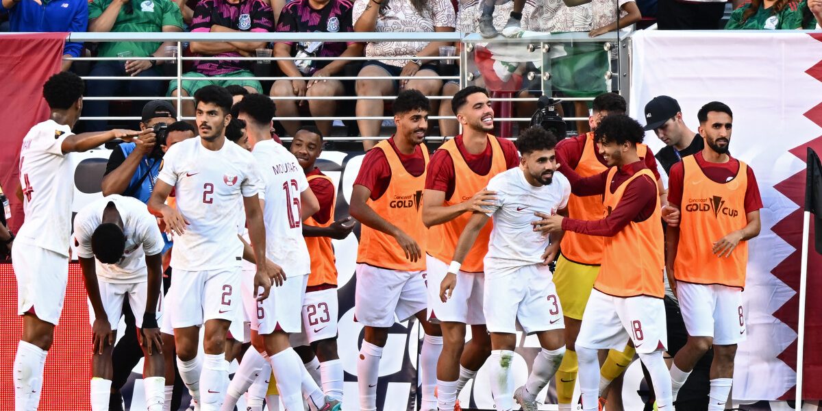 Qatar's defender Hazem Shehata (4th R) celebrates scoring his team's first goal with teammates during the Concacaf 2023 Gold Cup Group B football match between Mexico and Qatar at Levi's Stadium, in Santa Clara, California, on July 2, 2023. (Photo by Patrick T. Fallon / AFP)