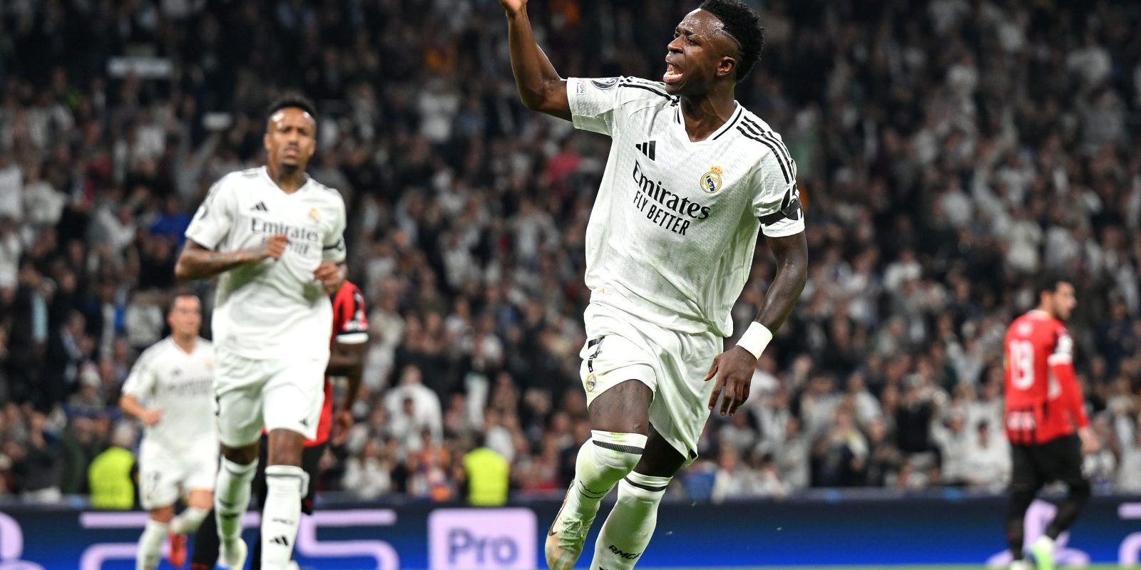 MADRID, SPAIN - NOVEMBER 05: Vinicius Junior of Real Madrid celebrates scoring his team's first goal from the penalty-spot during the UEFA Champions League 2024/25 League Phase MD4 match between Real Madrid C.F. and AC Milan at Estadio Santiago Bernabeu on November 05, 2024 in Madrid, Spain. (Photo by Michael Regan - UEFA/UEFA via Getty Images)