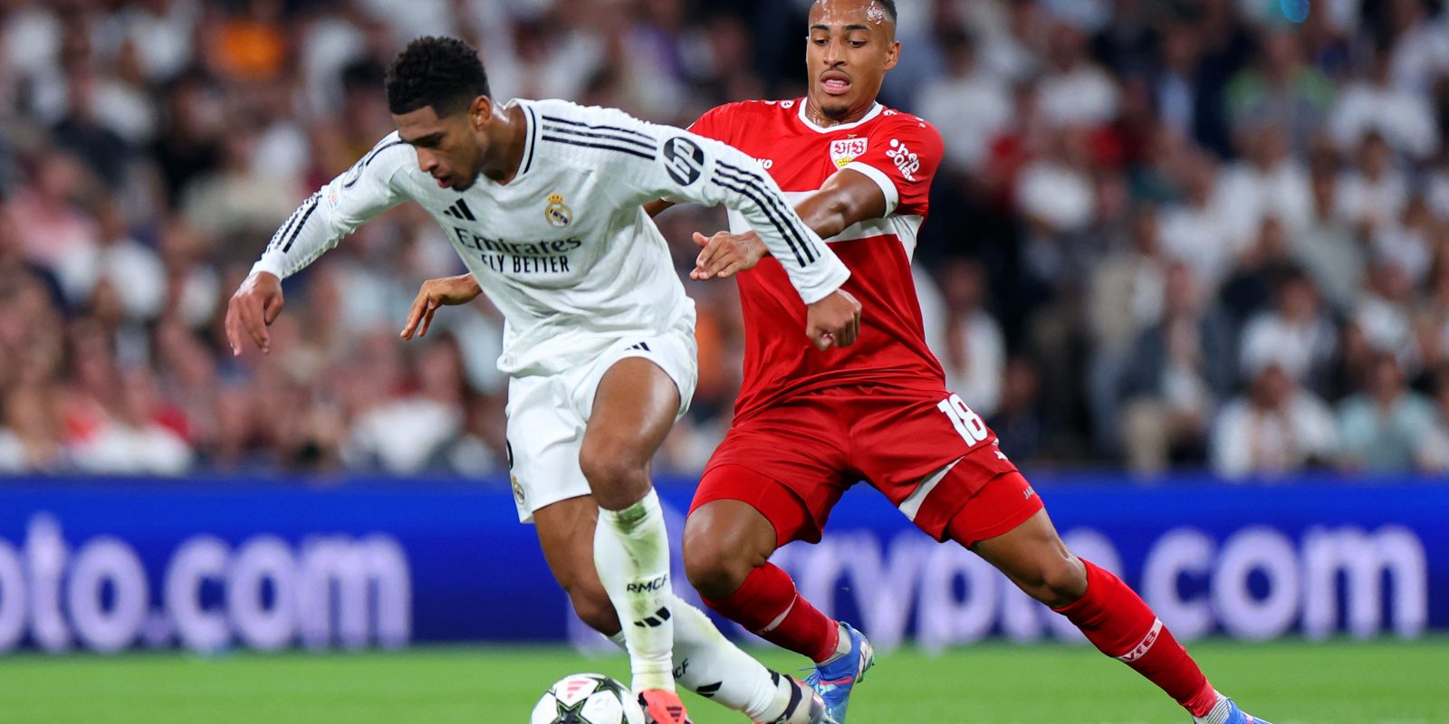 MADRID, SPAIN - SEPTEMBER 17: Jude Bellingham of Real Madrid is challenged by Jamie Leweling of VfB Stuttgart during the UEFA Champions League 2024/25 League Phase MD1 match between Real Madrid CF and VfB Stuttgart at Estadio Santiago Bernabeu on September 17, 2024 in Madrid, Spain. (Photo by Gonzalo Arroyo - UEFA/UEFA via Getty Images)