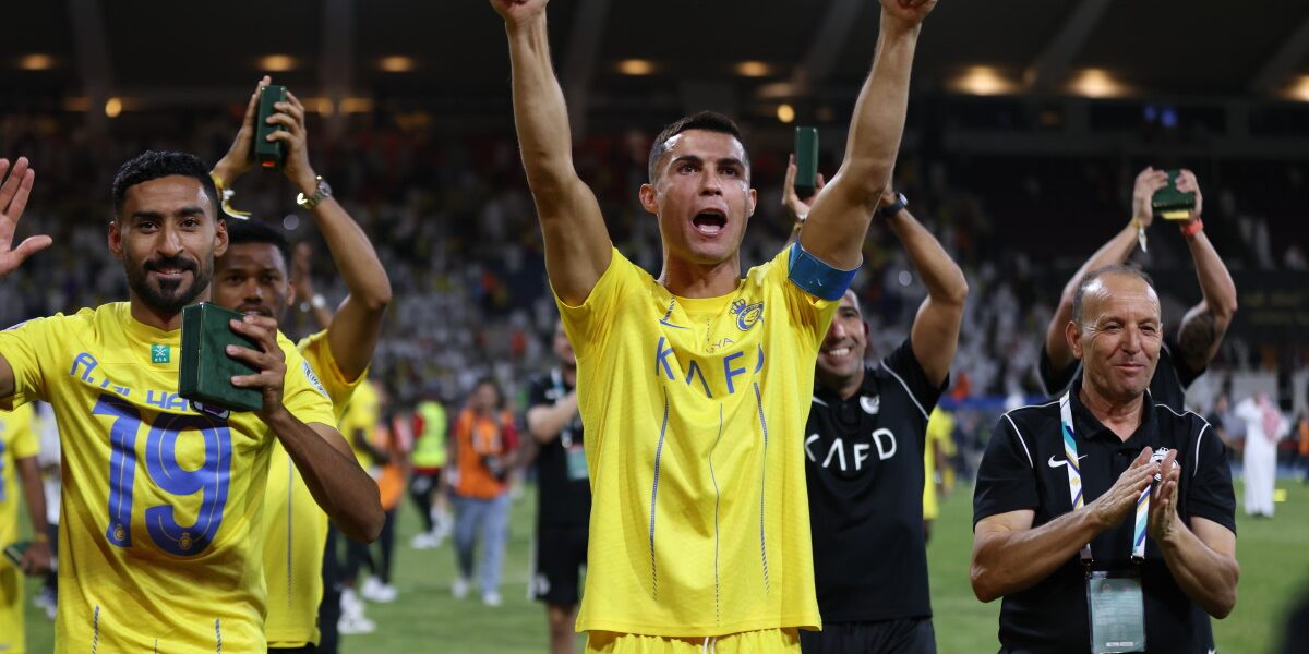 RIYADH, SAUDI ARABIA - AUGUST 12: Cristiano Ronaldo of Al Nassr celebrates with teammates after the team's victory in the Arab Club Champions Cup Final between Al Hilal and Al Nassr at King Fahd International Stadium in Riyadh, Saudi Arabia on August 12, 2023. Stringer / Anadolu Agency (Photo by STRINGER / ANADOLU AGENCY / Anadolu Agency via AFP)