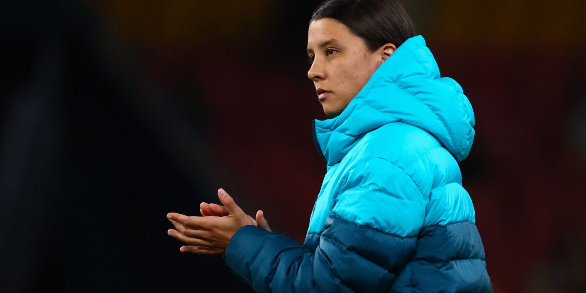 Injured Australia's captain Sam Kerr applauds the fans after her team's loss in the Australia and New Zealand 2023 Women's World Cup Group B football match between Australia and Nigeria at Brisbane Stadium in Brisbane on July 27, 2023. (Photo by Patrick Hamilton / AFP)