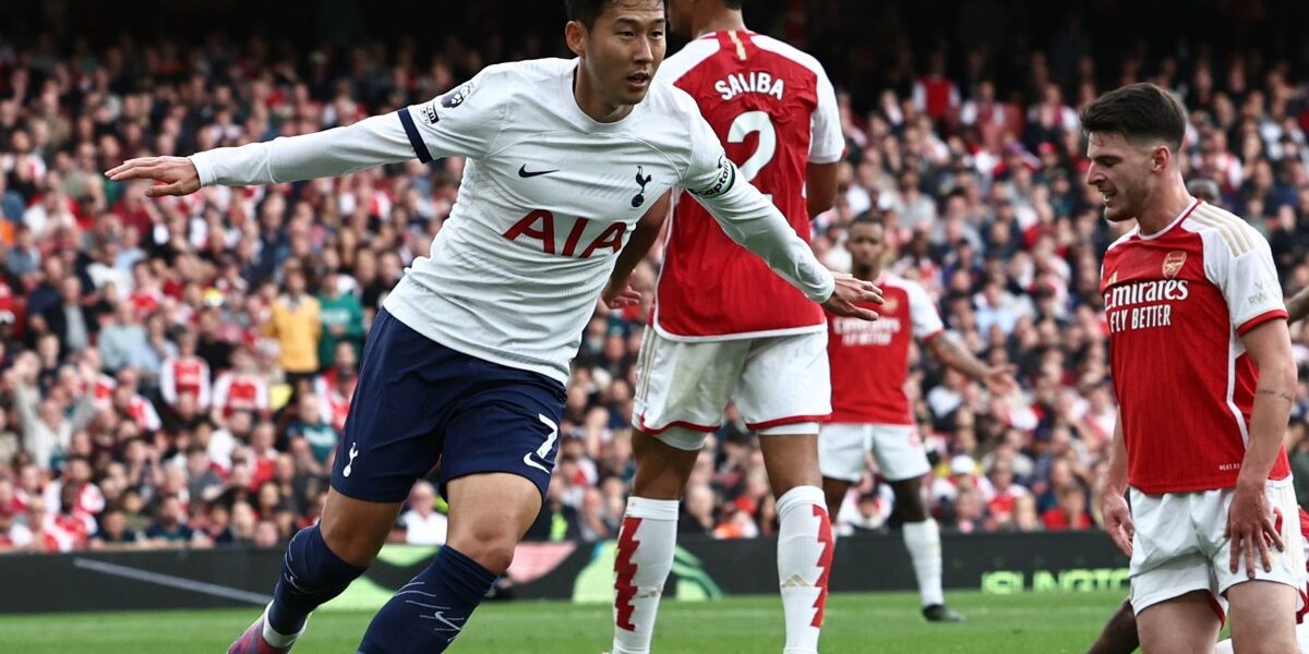 Tottenham Hotspur's South Korean striker #07 Son Heung-Min (L) celebrates after scoring their first goal during the English Premier League football match between Arsenal and Tottenham Hotspur at the Emirates Stadium in London on September 24, 2023. (Photo by HENRY NICHOLLS / AFP) / RESTRICTED TO EDITORIAL USE. NO USE WITH UNAUTHORIZED AUDIO, VIDEO, DATA, FIXTURE LISTS, CLUB/LEAGUE LOGOS OR 'LIVE' SERVICES. ONLINE IN-MATCH USE LIMITED TO 120 IMAGES. AN ADDITIONAL 40 IMAGES MAY BE USED IN EXTRA TIME. NO VIDEO EMULATION. SOCIAL MEDIA IN-MATCH USE LIMITED TO 120 IMAGES. AN ADDITIONAL 40 IMAGES MAY BE USED IN EXTRA TIME. NO USE IN BETTING PUBLICATIONS, GAMES OR SINGLE CLUB/LEAGUE/PLAYER PUBLICATIONS. - RESTRICTED TO EDITORIAL USE. No use with unauthorized audio, video, data, fixture lists, club/league logos or 'live' services. Online in-match use limited to 120 images. An additional 40 images may be used in extra time. No video emulation. Social media in-match use limited to 120 images. An additional 40 images may be used in extra time. No use in betting publications, games or single club/league/player publications. /