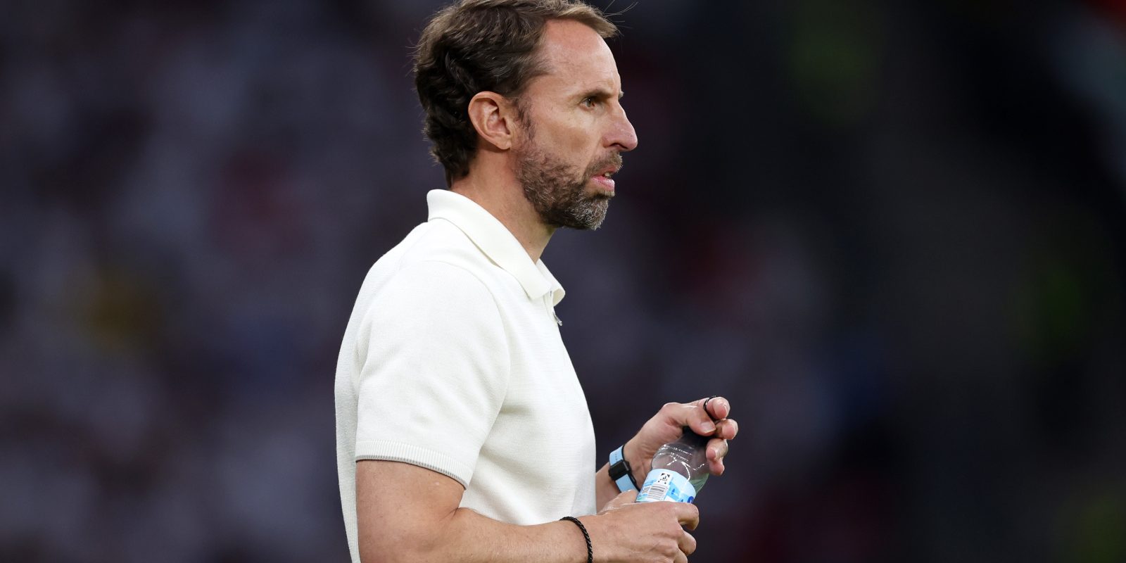 BERLIN, GERMANY - JULY 14: Gareth Southgate, Head Coach of England, takes a drink of water during the UEFA EURO 2024 final match between Spain and England at Olympiastadion on July 14, 2024 in Berlin, Germany. (Photo by Alex Pantling - UEFA/UEFA via Getty Images)