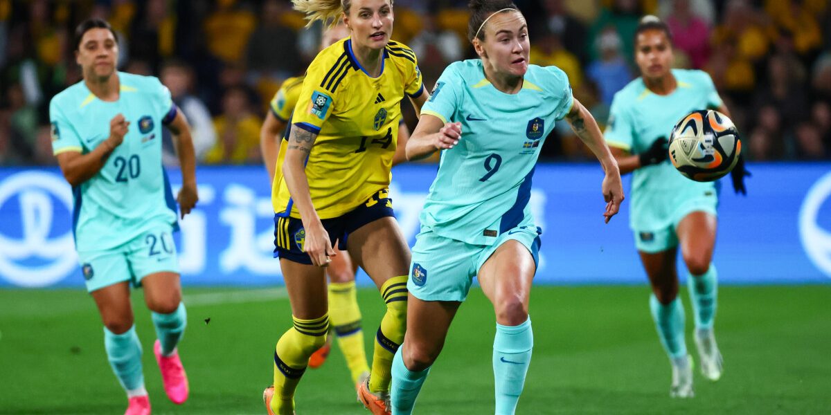 Sweden's defender #14 Nathalie Bjorn and Australia's forward #09 Caitlin Foord fight for the ball during the Australia and New Zealand 2023 Women's World Cup third place play-off football match between Sweden and Australia at Brisbane Stadium in Brisbane on August 19, 2023. (Photo by Patrick Hamilton / AFP)